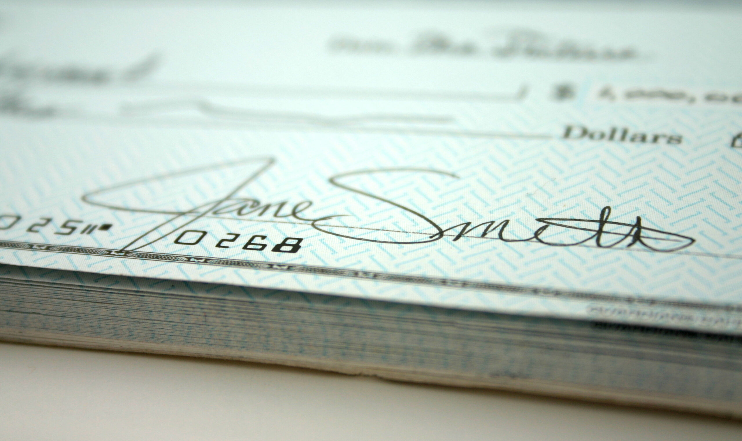Close-up of a bounced or returned check marked “insufficient funds,” symbolizing a bad check offense