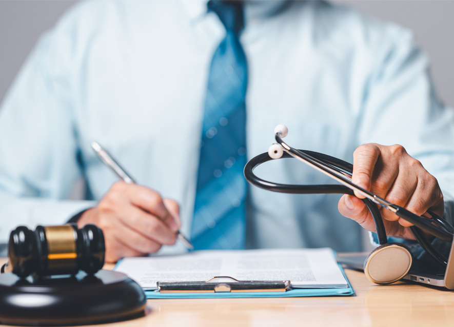 Personal injury victim in a medical sling with legal documents on a nearby table