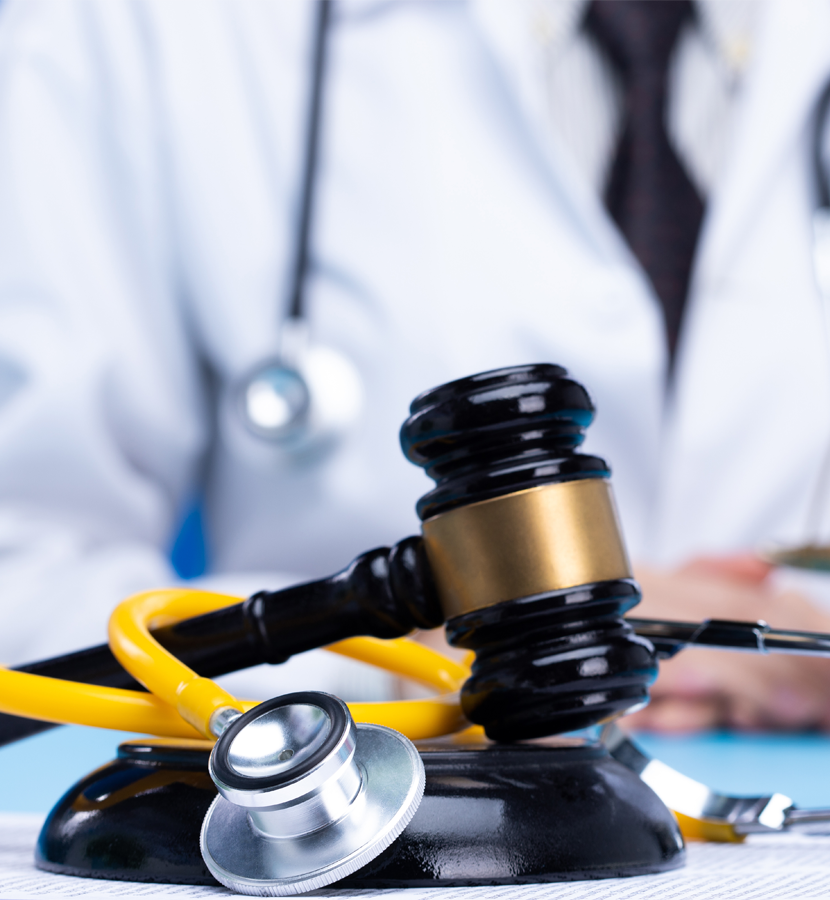 Wrongful death attorney reviewing medical documents with a doctor